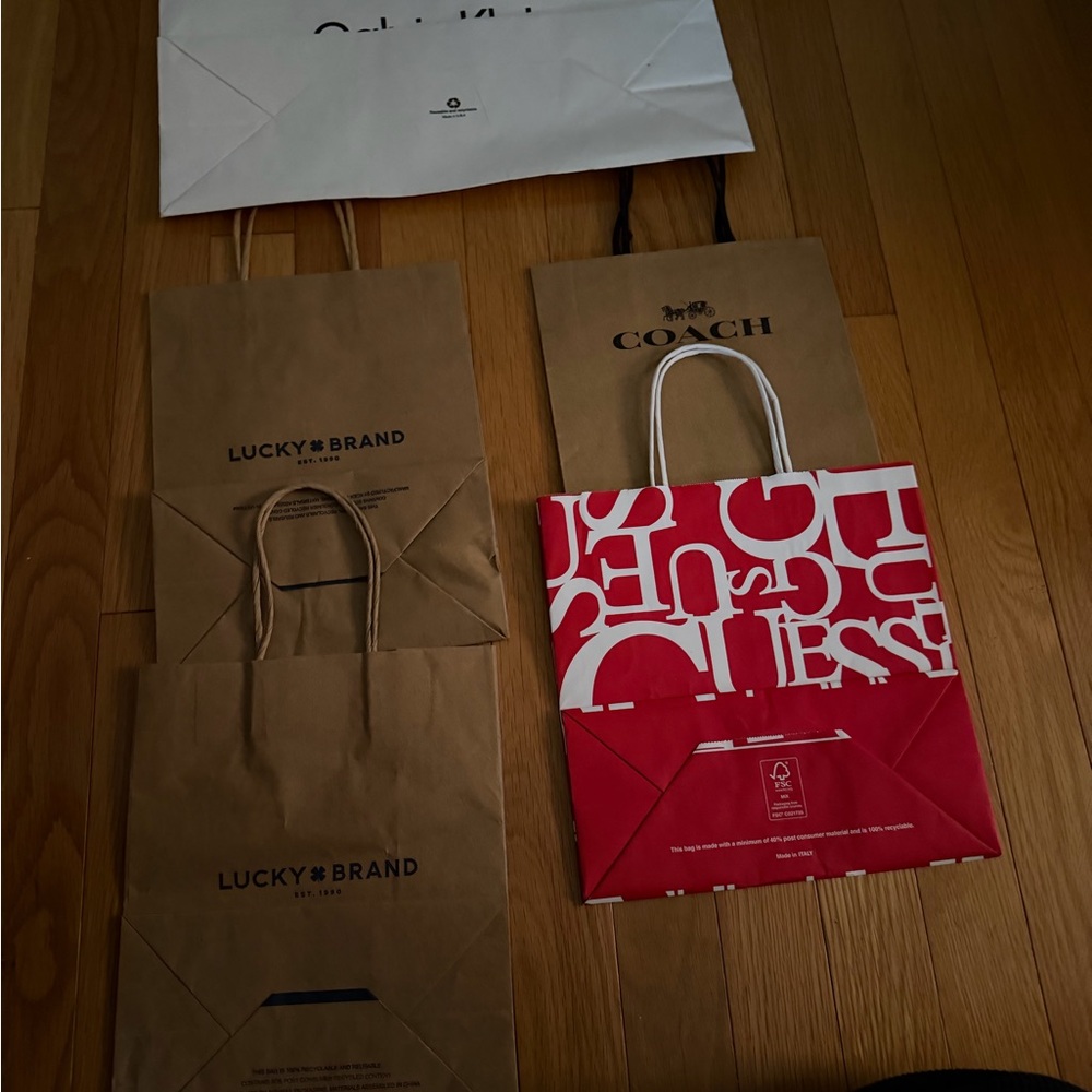 Bundle of 4 Assorted Designer Shopping Bags. Perfect for your gifts.